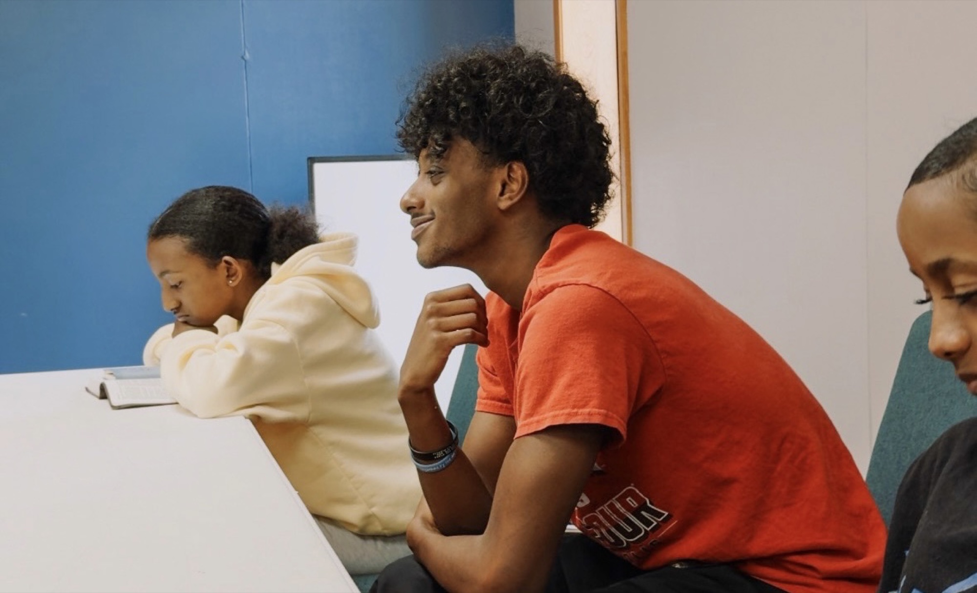 Youth listening during Bible study